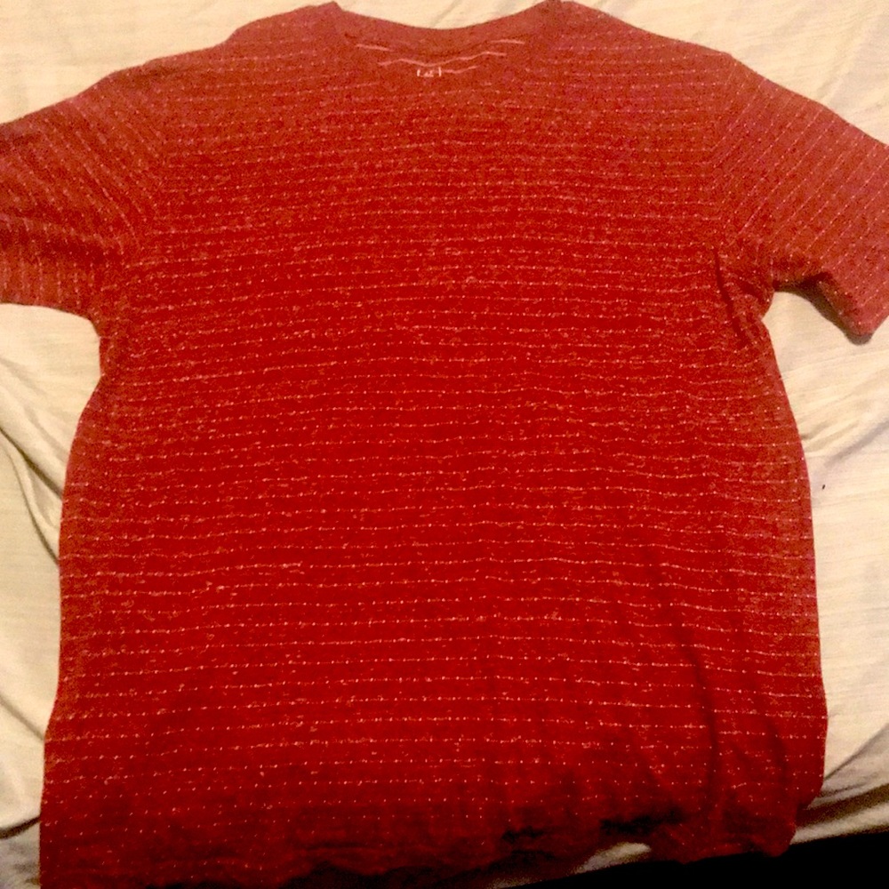 Never been worn simple red tshirt will pop off an outfit with a jacket